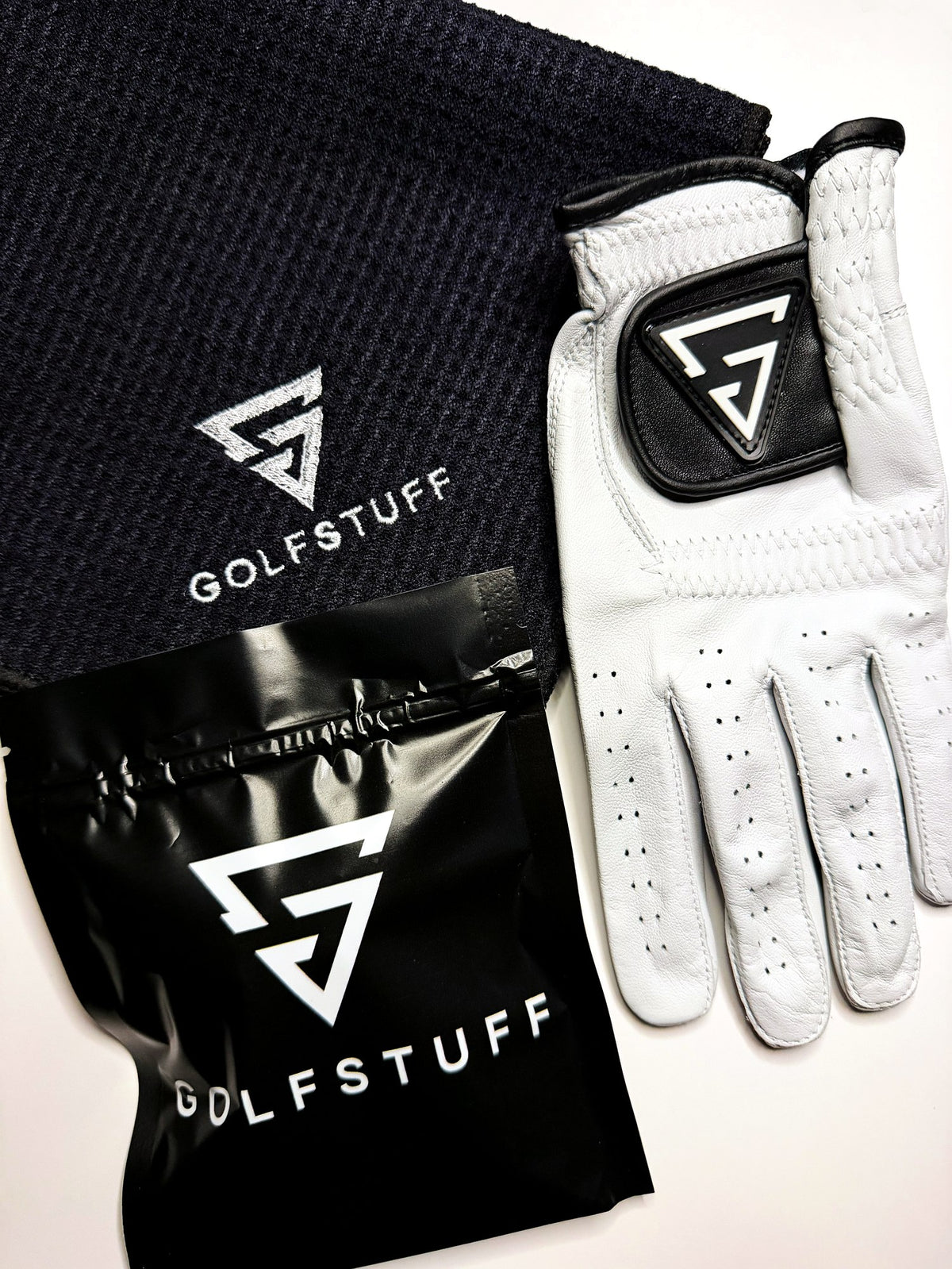 The Tee Off Collection - tees, glove and towel laid out together
