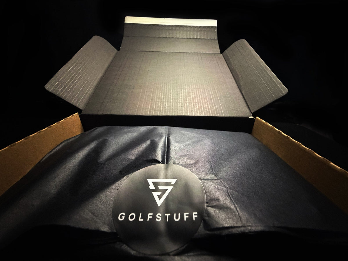 Golfstuff gift box opened, showing tissue paper wrap