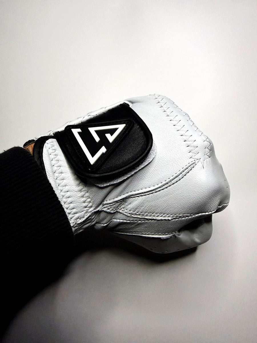 Close-up of the moulded Golfstuff logo patch on the glove